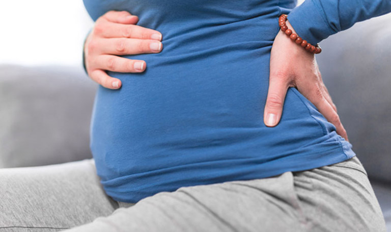 Đau bụng và đau lưng khi mang thai tháng đầu